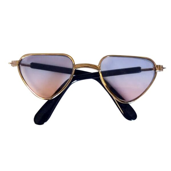 gold triangle frame glasses with purplish lenses