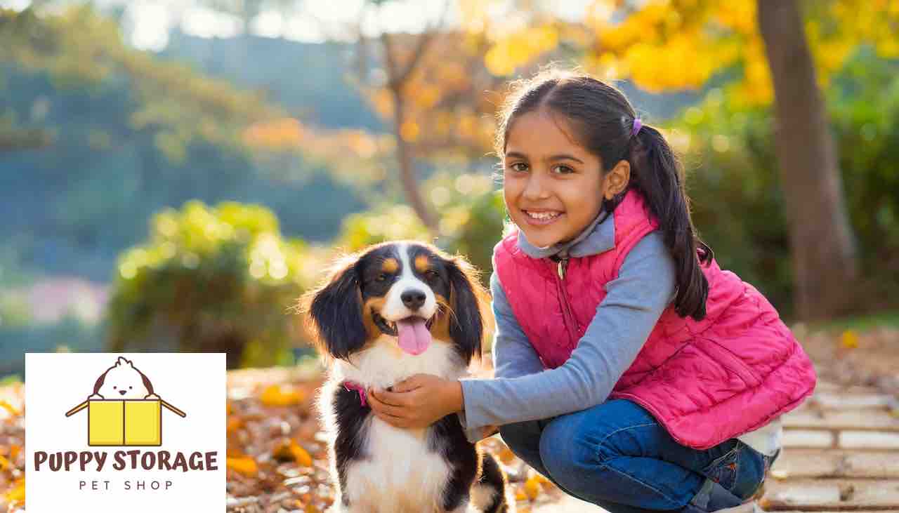 little girl with her pet dog puppystorage.com logo